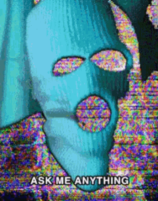 a person wearing a ski mask with the words `` ask me anything '' written on the bottom .