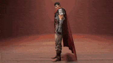 a man in armor with a red cape on his head