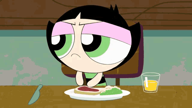buttercup from the powerpuff girls sitting at a table with a plate of food