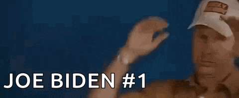 a man in a hat is giving the middle finger and says joe biden # 1