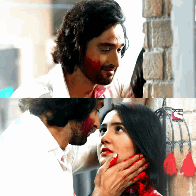 a man is touching a woman 's face with red paint and the word sony on the bottom right