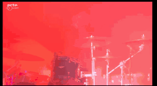 a red background with the words arte concert on the bottom right