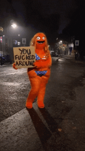 a person in a bikini holding a sign that says you fucked around