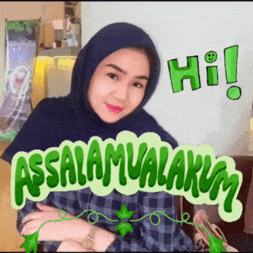 a woman wearing a hijab is sitting in front of a sign that says hi !