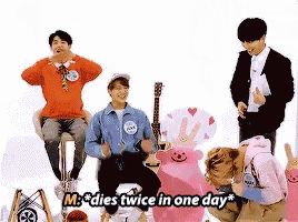 a group of people are sitting around a stuffed animal and one of them says m * dies twice in one day * .