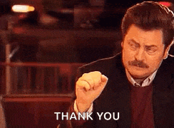 a man with a mustache is giving a fist bump and saying thank you .