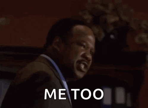 a man in a suit says " shhiiiiii me too "