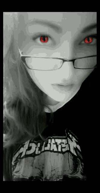 a girl wearing glasses and a metallica shirt