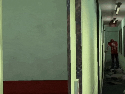 a man in a bloody shirt is walking down a hallway in a video game