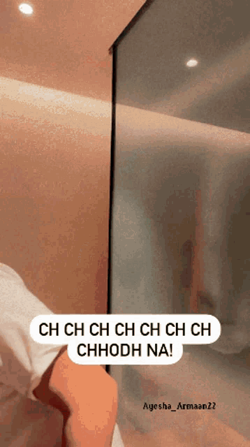 a person standing in front of a wall that says ch ch ch ch ch ch ch ch ch ch ch chodh na