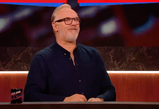 a man wearing glasses and a black shirt is clapping