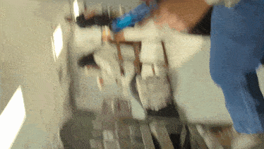 a blurry picture of a person in a blue shirt