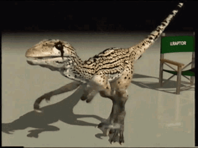 a 3d model of a raptor is standing next to a green director 's chair