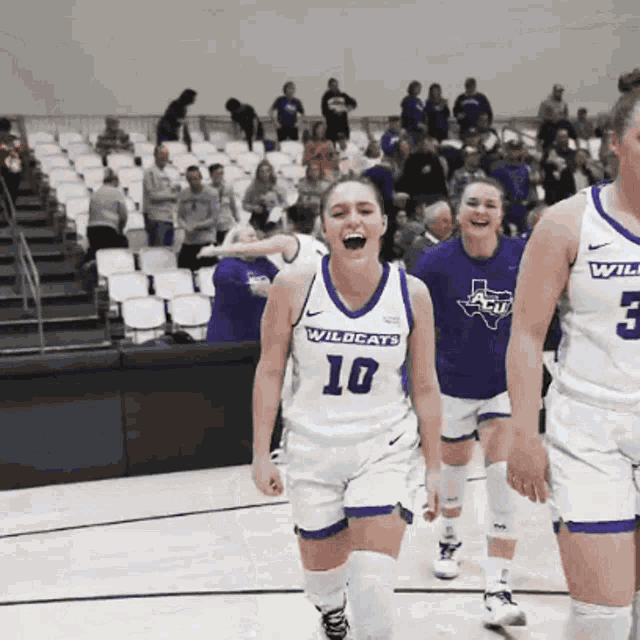 a female basketball player wearing a jersey with the number 10 on it