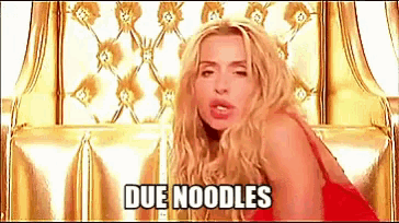 a blonde woman in a red dress is sitting on a gold chair and says " due noodles "