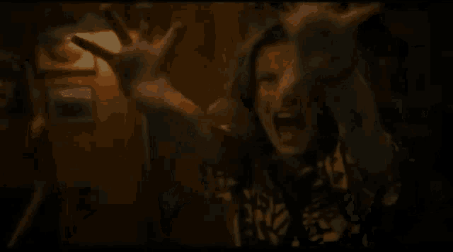 a close up of a person with their hands outstretched .