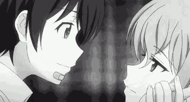 a boy and a girl are looking into each other 's eyes in a black and white photo .
