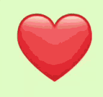 a large red heart on a green background