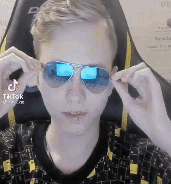a man wearing a pair of sunglasses with a tiktok watermark on it