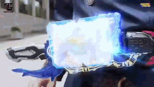 a person is holding a sword that is glowing in the dark