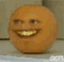 a close up of an orange with a smiley face on it 's face .