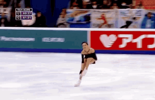 a woman is skating in front of a sign that says tech score on it