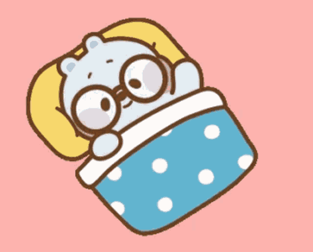 a cartoon bear is sleeping in a bed with glasses on .