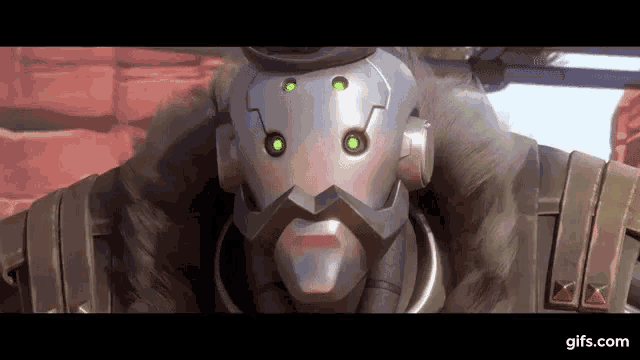 a man with a beard is wearing a helmet with green lights on it .