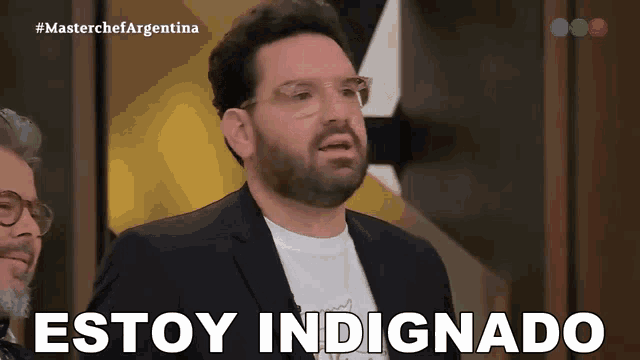 a man in a suit says estoy indignado in spanish