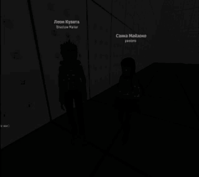 a man and a woman are standing next to each other in a dark room with a microphone in the foreground