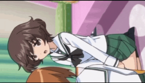 a girl in a white shirt and green skirt is laying on another girl 's lap