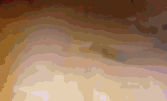 a close up of a cloudy sky with a few spots of light