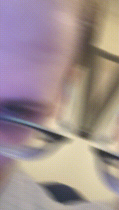 a blurry picture of a person 's face with a purple and yellow background