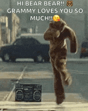 a teddy bear in a bear costume is running down a street .