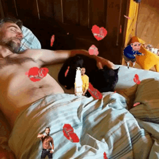 a shirtless man is laying in bed with a cat and hearts flying around him