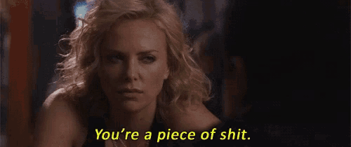 a woman is holding a glass of wine and says `` you 're a piece of shit '' .