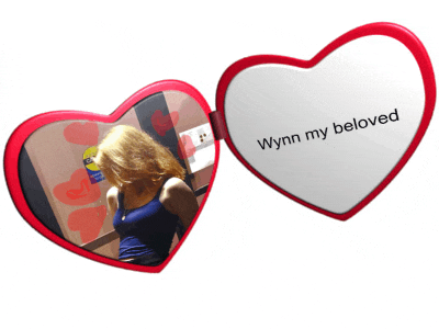 a heart shaped mirror with the words wynn my beloved on it