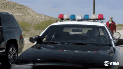 a showtime advertisement shows a police car driving down the road