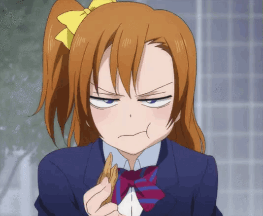a girl with a ponytail and a bow on her head is making an angry face