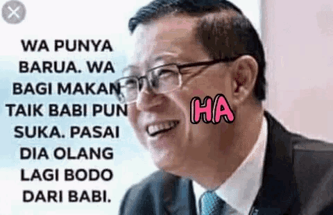 a man in a suit and tie is smiling with ha written on his face ..