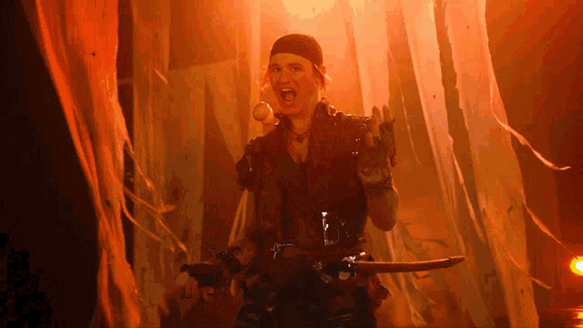 a man in a pirate outfit is holding a sword in his hand