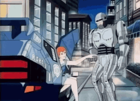a robot and a woman are standing next to each other in front of a robocop car .