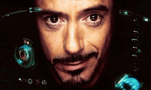 a close up of a man 's face with a t.v. on his head