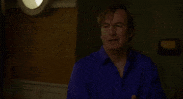 a man in a blue shirt says that 's it