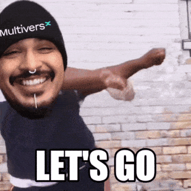 a man wearing a hat that says " multivers " on it says " let 's go "