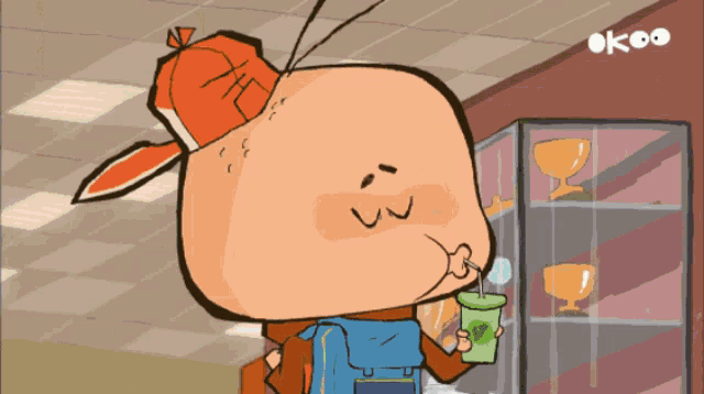 a cartoon character is drinking from a green cup with a straw while wearing an orange hat