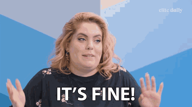 a woman says it 's fine in front of a blue background