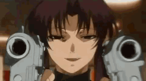 a close up of a girl holding two guns in her hands .