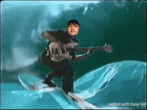 a man is riding a wave on a surfboard while playing a guitar edited with easy gif