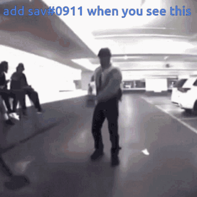 a blurry picture of a man dancing in a parking garage with the words add sav # 0911 when you see this